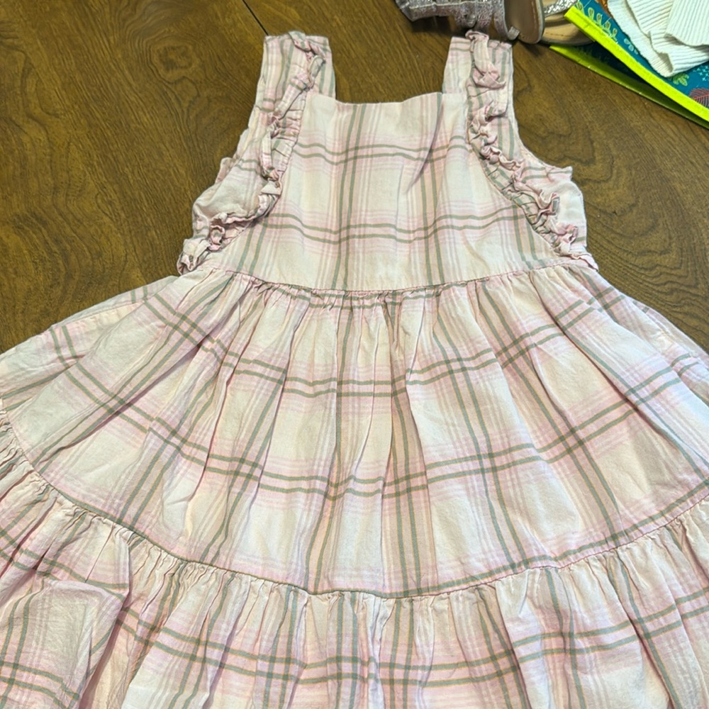 Plaid pink and green striped dress. Ruffled dress with buttons down the back.